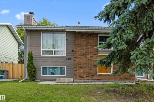 Split-level residence featuring a combination of brick and horizontal siding - 4810 55 Avenue, Beaumont, AB - Outdoor