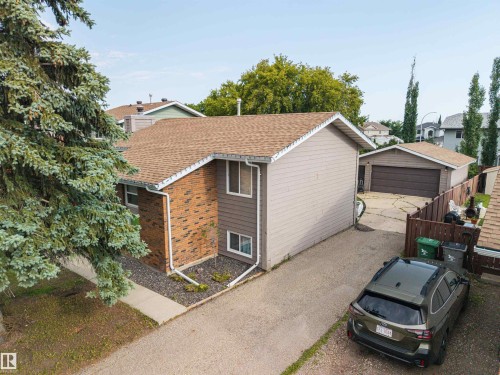 Two-story exterior with brick and siding facade - 4810 55 Avenue, Beaumont, AB - Outdoor With Exterior
