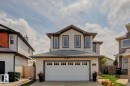 Contemporary two-story residence featuring light-toned siding and dark trim accents - 16765 119 Street Nw, Edmonton, AB  - Outdoor 