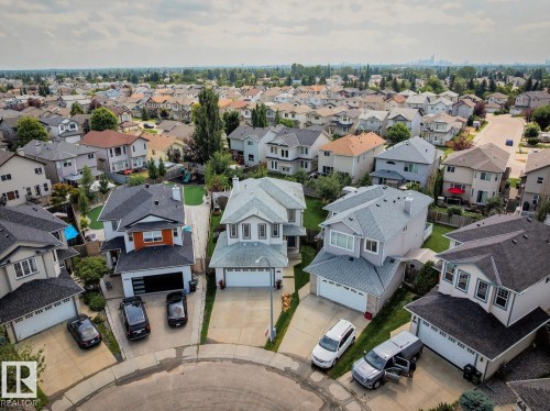 Aerial perspective showcasing a residential neighborhood with varied architectural styles and mature landscaping - 16765 119 Street Nw, Edmonton, AB - Outdoor With View