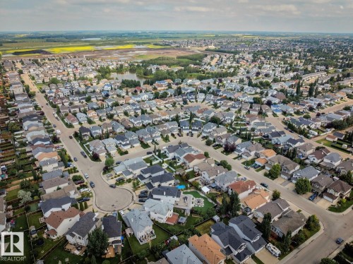Aerial perspective showcasing a residential neighborhood with varied architectural styles - 16765 119 Street Nw, Edmonton, AB - Outdoor With View