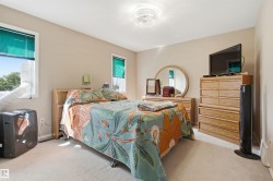 Room featuring light-colored wall paint and neutral carpet flooring - 