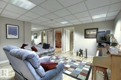 The interior features light-toned walls, a drop ceiling with integrated lighting, and light-colored flooring - 