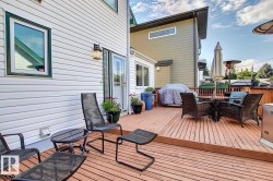 Expansive wooden deck with space for outdoor seating and dining - 