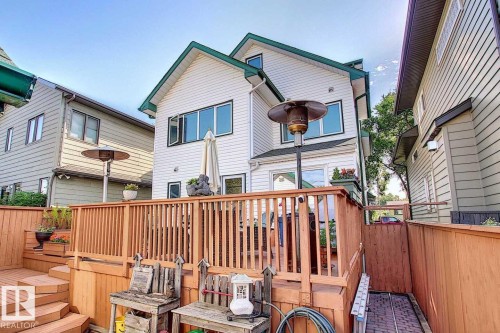 The property features a multi-level wooden deck with natural wood railings - 11126 52 Street Nw, Edmonton, AB - Outdoor With Deck Patio Veranda With Exterior