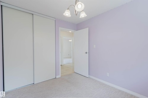 Room featuring light violet walls and light gray carpet - 134 Callingwood Place Nw, Edmonton, AB - Indoor Photo Showing Other Room