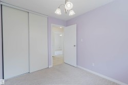 Room featuring light violet walls and light gray carpet - 