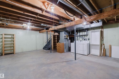 Unfinished basement with exposed wooden joists and concrete flooring - 134 Callingwood Place Nw, Edmonton, AB - Indoor Photo Showing Basement