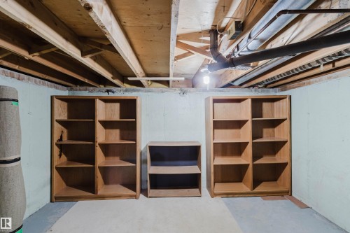 Unfinished basement space featuring exposed wood joists and utility piping - 134 Callingwood Place Nw, Edmonton, AB - Indoor Photo Showing Basement