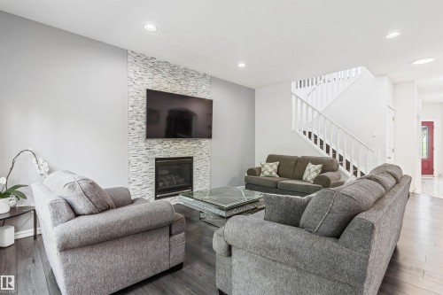 1075 Mckinney Green Nw, Edmonton, AB - Indoor Photo Showing Living Room With Fireplace