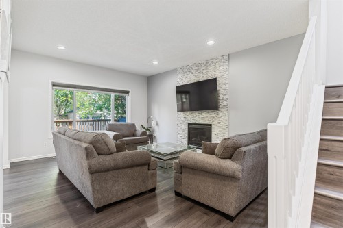 1075 Mckinney Green Nw, Edmonton, AB - Indoor Photo Showing Living Room With Fireplace