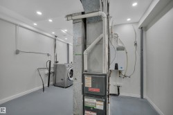 Utility room featuring a furnace, water heater, and washer - 