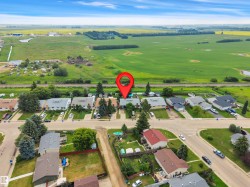 Residential neighborhood setting featuring single-family homes with mature landscaping - 