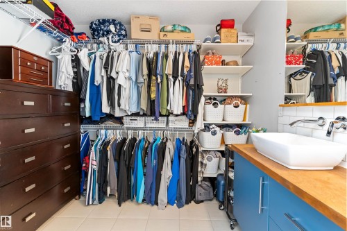 Walk-in closet featuring extensive wire shelving and hanging rods - 3456 Cutler Crescent Sw, Edmonton, AB - Indoor With Storage