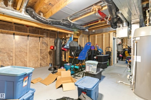 Unfinished basement featuring exposed wood framing, insulated walls, and concrete flooring - 3456 Cutler Crescent Sw, Edmonton, AB - Indoor Photo Showing Basement
