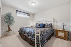 Carpeted room with a window featuring blinds and a valance - 