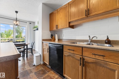 #6 12104 16 Av Sw, Edmonton, AB - Indoor Photo Showing Kitchen With Double Sink