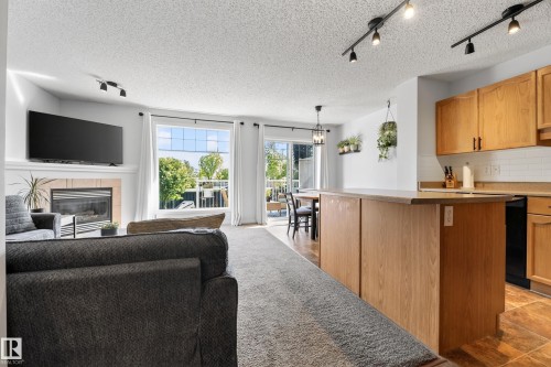 #6 12104 16 Av Sw, Edmonton, AB - Indoor With Fireplace