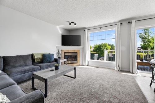 #6 12104 16 Av Sw, Edmonton, AB - Indoor Photo Showing Living Room With Fireplace