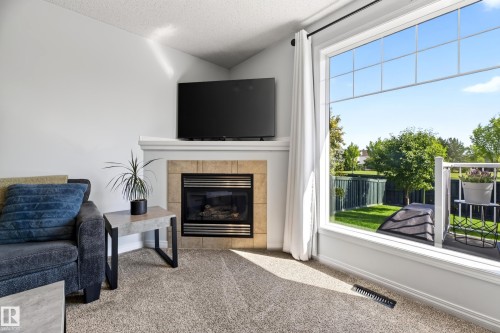 #6 12104 16 Av Sw, Edmonton, AB - Indoor Photo Showing Living Room With Fireplace