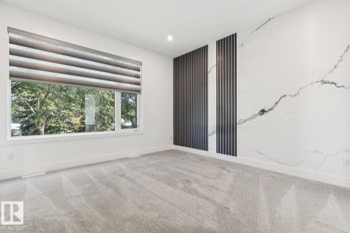 Room featuring a wide window with a dual-layer roller shade - 10531 67 Avenue Nw, Edmonton, AB - Indoor Photo Showing Other Room