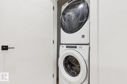 White stacked washer and dryer unit - 