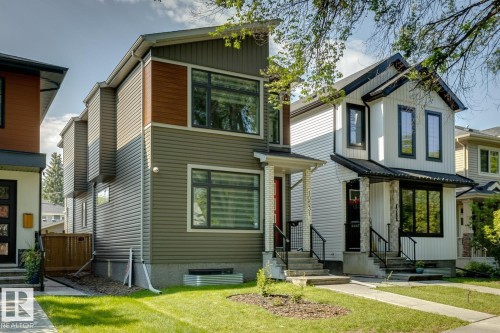 Modern-style home featuring horizontal siding, wood-look accents, and black-framed windows - 10531 67 Avenue Nw, Edmonton, AB - Outdoor With Facade