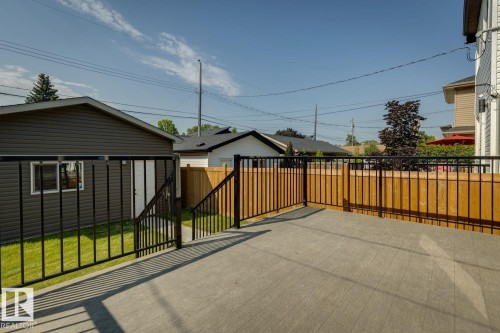 Spacious composite deck with dark metal railings - 10531 67 Avenue Nw, Edmonton, AB - Outdoor With Exterior