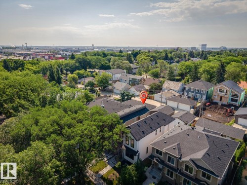 Aerial perspective showcasing a residential area with mature trees and varied architectural styles - 10531 67 Avenue Nw, Edmonton, AB - Outdoor With View