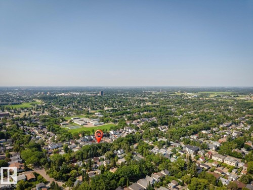 Extensive residential area with a prominent green space and distant urban skyline - 10531 67 Avenue Nw, Edmonton, AB - Outdoor With View