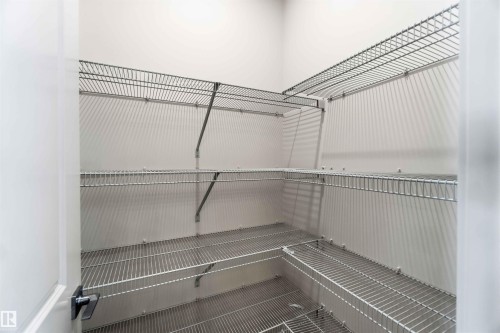 Walk-in pantry with comprehensive wire shelving system - 223 157 Avenue Ne, Edmonton, AB - Indoor With Storage