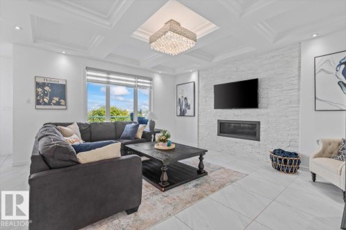1242 Starling Drive Nw, Edmonton, AB - Indoor Photo Showing Living Room With Fireplace