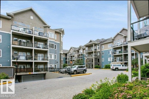 Multi-story residential complex featuring private balconies with glass railings - #137 10121 80 Av Nw, Edmonton, AB - Outdoor
