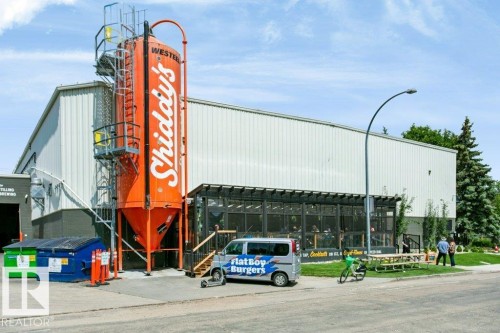 Industrial-style building with a prominent orange silo feature - #137 10121 80 Av Nw, Edmonton, AB - Outdoor