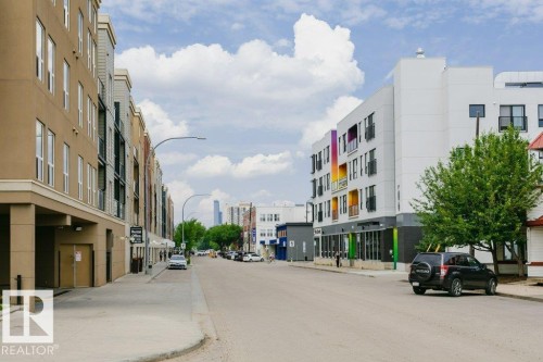 Urban street scene featuring multi-story buildings with varied facades - #137 10121 80 Av Nw, Edmonton, AB - Outdoor