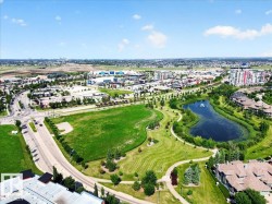 Expansive aerial perspective showcasing a significant green space with manicured landscaping - 