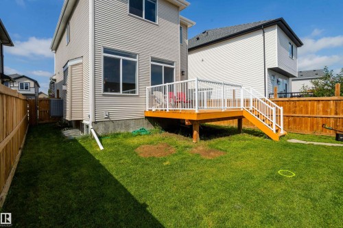 Wood deck with white railing and stairs - 17707 59 Street Nw, Edmonton, AB - Outdoor With Deck Patio Veranda With Exterior