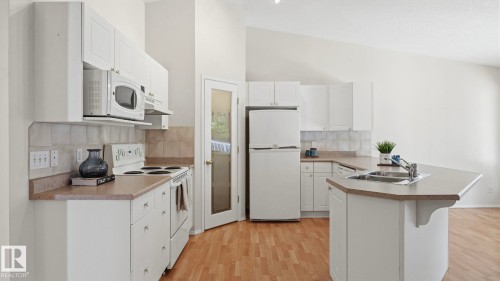 #31 8 Dechene Rd Nw, Edmonton, AB - Indoor Photo Showing Kitchen With Double Sink