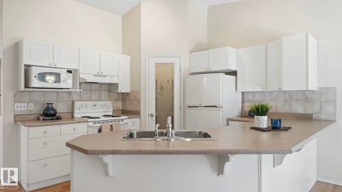 #31 8 Dechene Rd Nw, Edmonton, AB - Indoor Photo Showing Kitchen With Double Sink