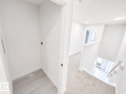 #38 7110 Keswick Cm Sw, Edmonton, AB - Indoor Photo Showing Other Room