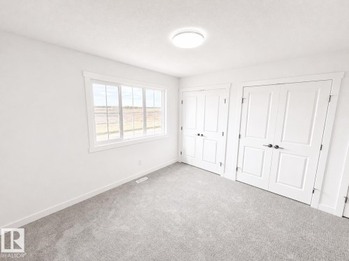 #38 7110 Keswick Cm Sw, Edmonton, AB - Indoor Photo Showing Other Room