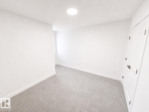#38 7110 Keswick Cm Sw, Edmonton, AB - Indoor Photo Showing Other Room
