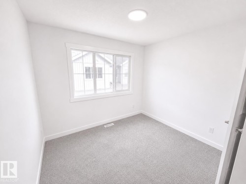 #38 7110 Keswick Cm Sw, Edmonton, AB - Indoor Photo Showing Other Room