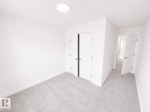 #38 7110 Keswick Cm Sw, Edmonton, AB - Indoor Photo Showing Other Room