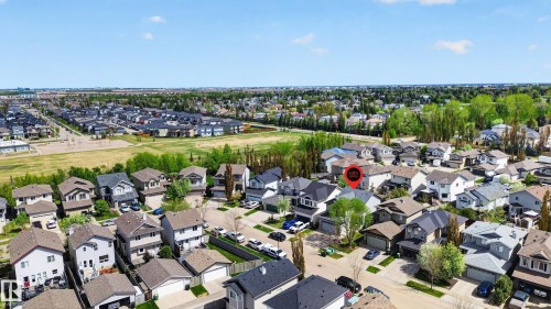 Aerial perspective showcasing a residential area with varied housing styles - 9 Snowbird Crescent, Leduc, AB - Outdoor With View