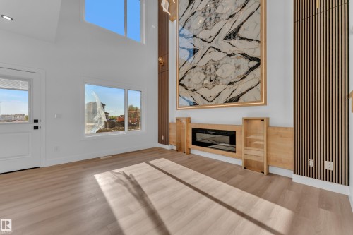 Vaulted ceilings with upper-level windows - 382 Linden Loop, Leduc, AB - Indoor Photo Showing Living Room With Fireplace