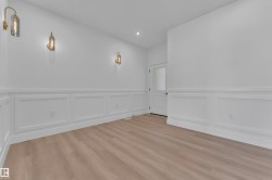 Hardwood-finish flooring complementing white wainscoting - 