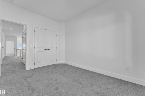 Neutral wall finishes with a plush carpet flooring - 382 Linden Loop, Leduc, AB - Indoor Photo Showing Other Room