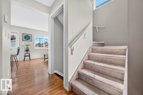 Carpeted staircase with white handrail leading to an upper level - 17411 90 Street Nw, Edmonton, AB - Indoor Photo Showing Other Room