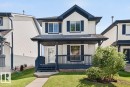 Two-story exterior with light-colored siding and dark trim - 17411 90 Street Nw, Edmonton, AB  - Outdoor With Deck Patio Veranda 